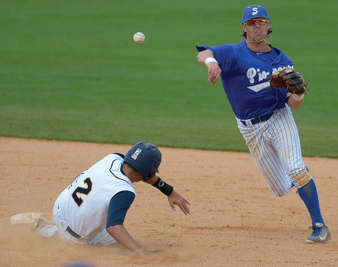 Spartanburg Methodist’s Champ Rowland throws over Florence-Darlington Tech’s sliding Aaron Bishop to complete a double play in Tuesday’s Region X Tournament game at Burlington Athletic Stadium.