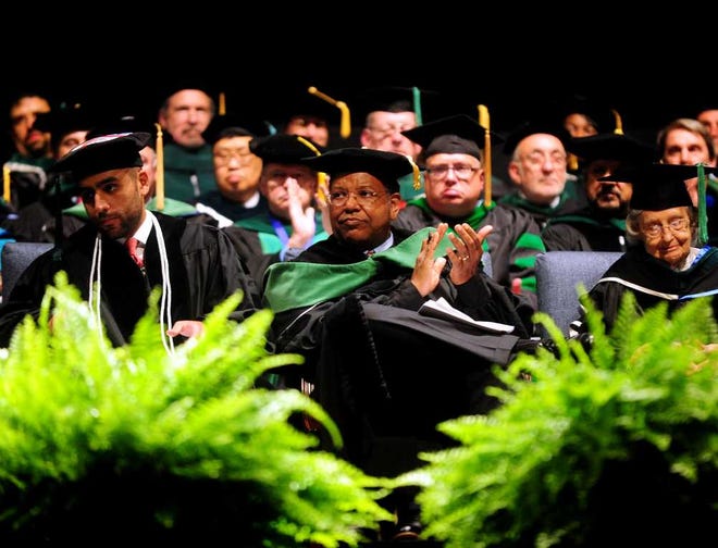 Dr. Otis Brawley (center), the chief medical officer of the American Cancer Society, attends the Hooding Ceremony for MCG. Brawley says one of the biggest health concerns is obesity.