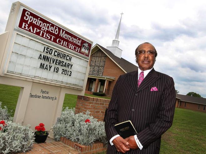 Springfield Memorial Baptist Church celebrates its 150 th homecoming on May 19. Here, the Rev. Theodore Armstrong stands in front of the church.