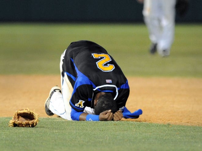 Auburndale's Reyni Olivero drops to the ground after a heartbreaking loss in the regional final at Tampa Jesuit. Auburndale lost 5-4 after giving up two runs in the bottom of the seventh.