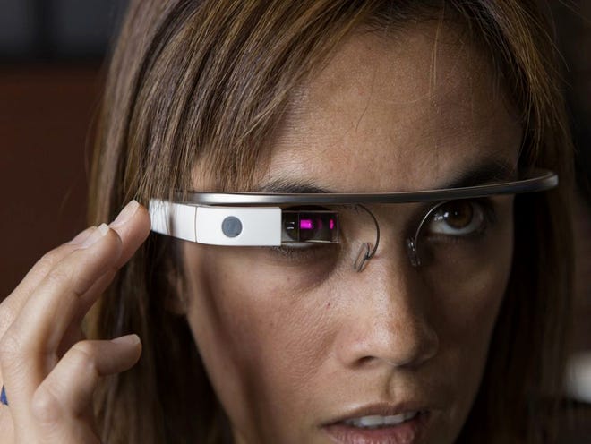 Software developer Monica Wilkinson demonstrates Google Glass recently. The electronic glasses are not yet available to the public, but some developers have been able to buy them to prepare apps. They cost $1,500 but are getting good reviews so far. 
JOHN GREEN | SAN JOSE MERCURY NEWS
