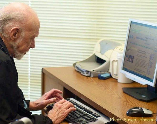Frank Field at work on the computer. Contributed photo