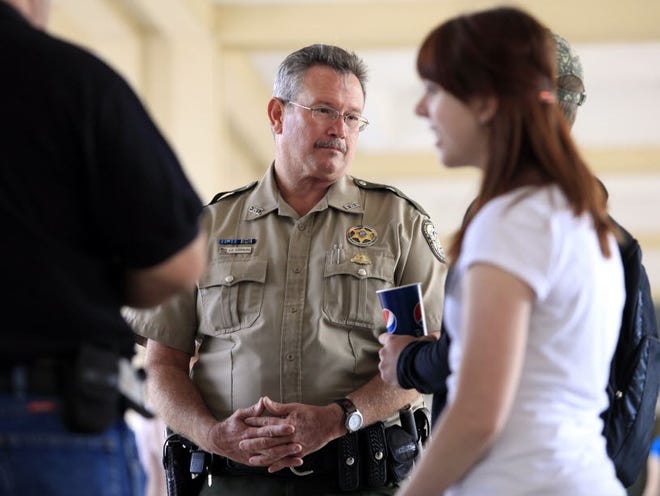 Officer Jeff Summers, who is retiring from the Florida Fish and Wildlife Conservation Commission after 30 years, attends a recruiting drive at the Reitz Union colonnade at the University of Florida in Gainesville on March 20.