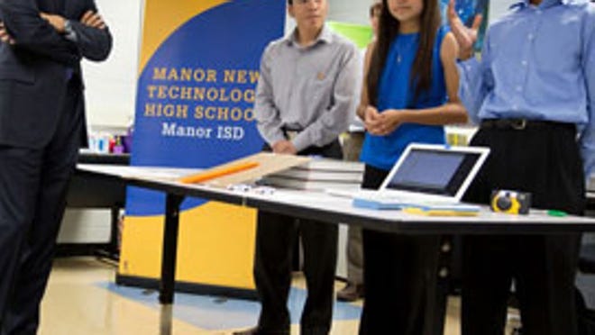 President Barack Obama tours a classroom at Manor New Technology High School. Francisco Martinez (left) said he was initially told he would not be able to meet the president because he came into the country illegally.