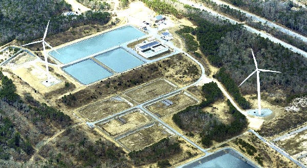 Two 1.65-megawatt wind turbines - Wind 1 and Wind 2 - are seen at the wastewater treatment facility in Falmouth in this March 27 aerial photo. The Falmouth Zoning Board of Appeals agreed with an abutter on Thursday that Wind 1 is too noisy.