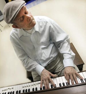 Holy Angels resident "Butch" plays piano. "Butch", 71, is a savant who is blind since birth, can play anything on the piano after hearing it once.
