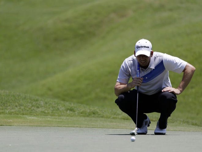 Sergio Garciae looks at his shot on the ninth green during the second round of The Players Championship.
 JOHN RAOUX | THE ASSOCIATED PRESS
