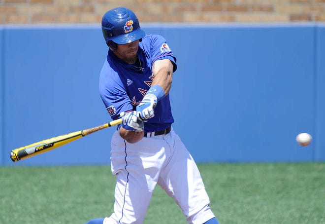 Kansas' Alex DeLeon smashes one of his two home runs Saturday against Kansas State. DeLeon's blasts helped the Jayhawks gain an early 6-0 lead, but the Wildcats rallied for a 9-6 victory to secure a series win.