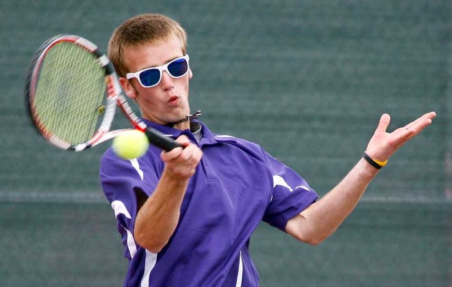 Topeka West's Austin Davids returns a ball to his opponent Friday afternoon during the second round of the state tennis championship in Emporia.