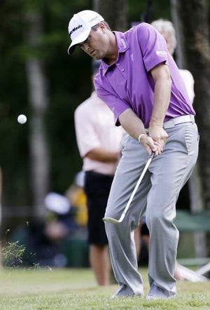 Ryan Palmer chips onto the sixth green during Sunday's final round. Palmer shot a 72 to finish tied for fifth place, three shots behind winner Tiger Woods, for his best finish at The Players Championship in seven tries.  Gerald Herbert Associated Press
