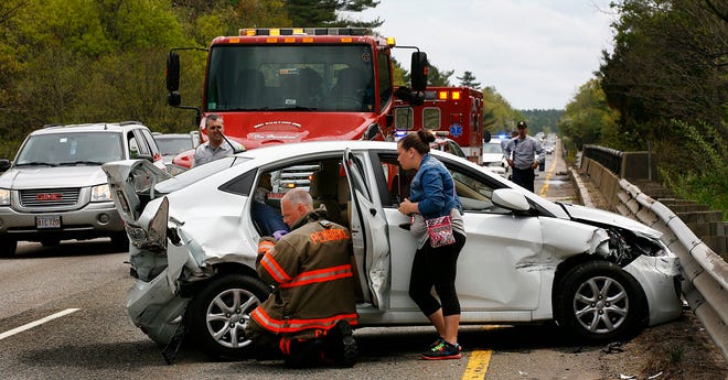 One of three victims from a six car accident on Route 3 in Pembroke is cared for by Pembroke emergency personnel before transport to the hospital. The northbound accident caused long delays on the roadway on the afternoon of Sunday, May, 12, 2013.
