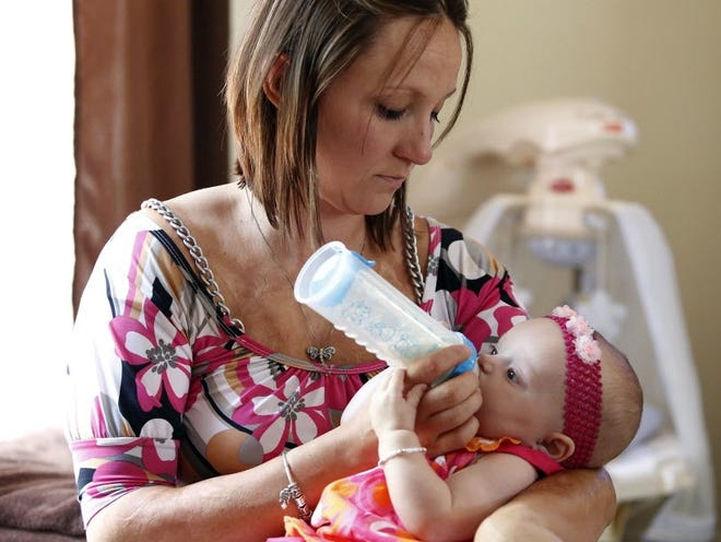 Tiffany Scott donated her baby Braelyn Scott's cord blood, which is rich in stem cells and can be used in transplant patients with a variety of conditions, shown at home in Newberry, Fla., Friday, May 10, 2013.