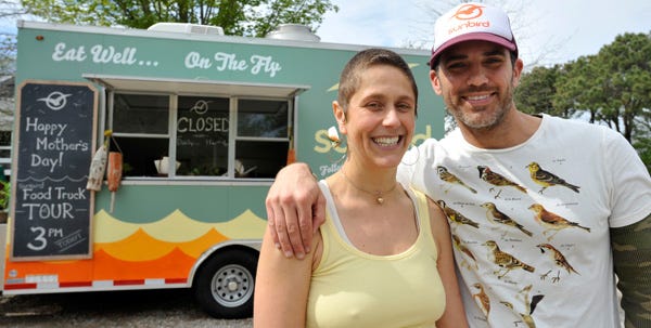 Sunbird food truck owners Jaime and Christian Sparrow pose next to their truck in Brewster.