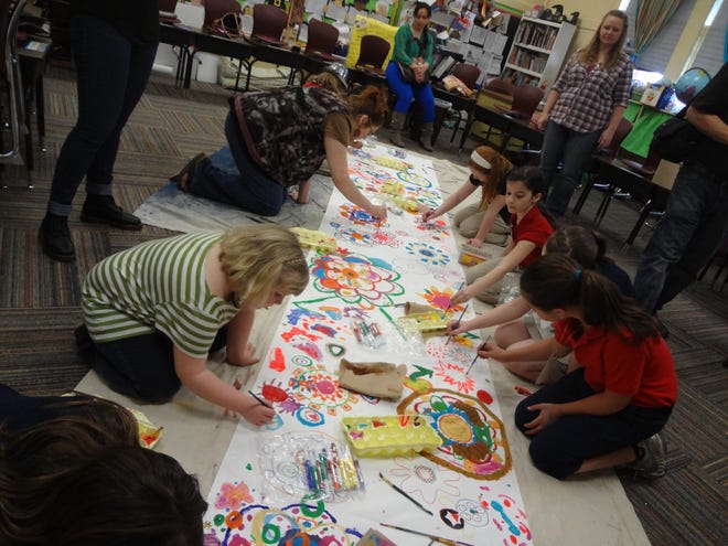 Circle Painting - a collaborative event of painting, movement and music lead by third through fifth grade Art Club members.