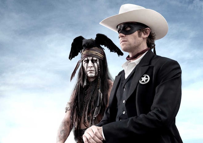 This undated publicity photo from Disney/Bruckheimer Films, shows actors, Johnny Depp, left, as Tonto, a spirit warrior on a personal quest, who joins forces in a fight for justice with Armie Hammer, as John Reid, a lawman who has become a masked avenger in "The Lone Ranger." (AP Photo/Disney/Bruckheimer Films, Peter Mountain)
