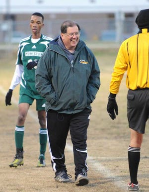 Photo by Jim Blaylock Greenbrier boys soccer coach Chip Warren smiles as he talks to a refree on the sidelines during a game on March 26, 2013. Warren has announced that he will retire at the end of this season.