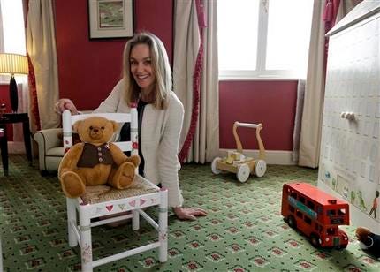 In this Tuesday, April 30, 2013 photo, Lucinda Croft, the managing director of Dragons, a small British family business that was also tapped to design nurseries for British royals, poses for the photographer as she showcases a hotel nursery suite at a central London hotel.