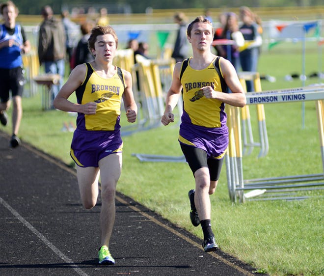Bronson's Matt Cosby (left) and Hunter Machus (right) extend their lead in the 1600 meter run. Machus and Cosby went 1-2 in the event. Derek Booher Photo
