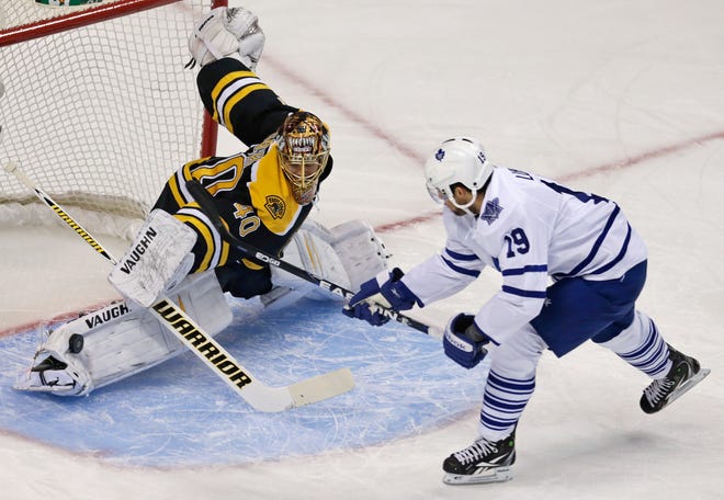 Boston Bruins goalie Tuukka Rask makes a pad save on a shot by Toronto Maple Leafs right wing Joffrey Lupul during the first period in Game 7 of their NHL Stanley Cup playoff series in Boston, Monday, May 13, 2013.