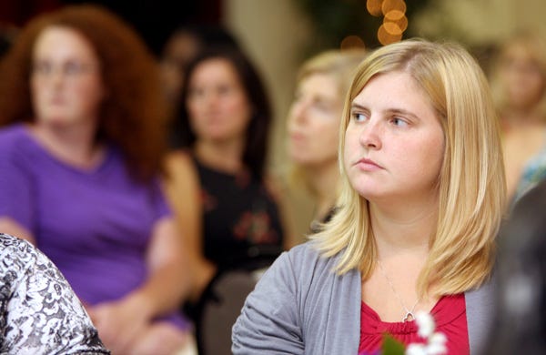 Danielle Swink listens to a budget presentation in 2011. Swink lost her job at Washington Elementary School that April after state budget cuts eliminated funding for some teacher assistant positions. (Star file photo)