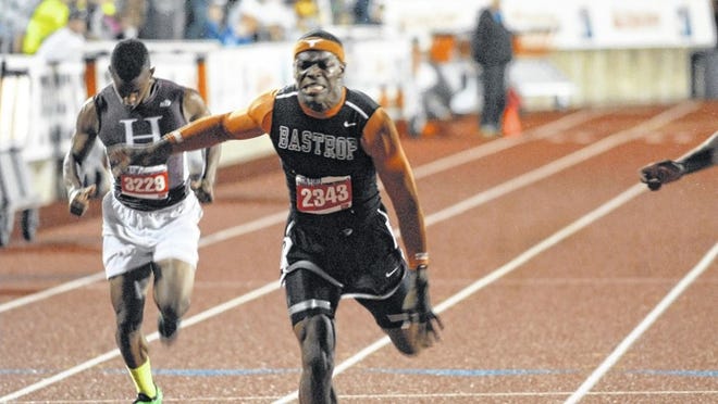 Batrop’s Antwuan Davis lunges forward at the finish line to take home second place in the 200 meter dash at the UIL Track and Field Championships in Austin on May 10.