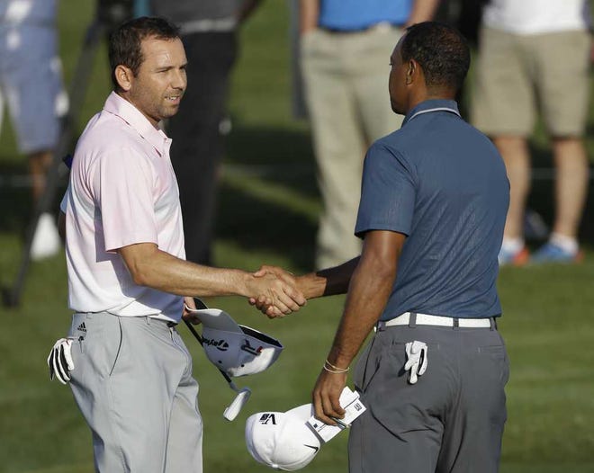 Sergio Garcia (left) suggested that Tiger Woods might have instigated a disruptive cheer about the time the Spaniard was playing a shot  in the third round of The Players Championship, won by Woods.