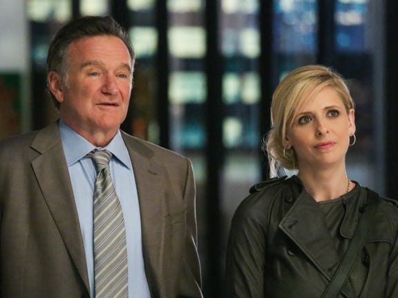 This publicity image released by CBS shows Robin Williams, left, and Sarah Michelle Gellar in a scene from the pilot episode of "The Crazy Ones," a new CBS comedy premiering in the fall of 2013.