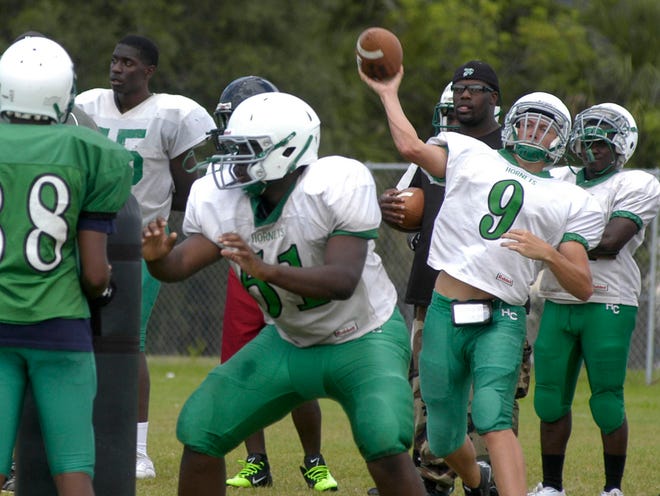 Haines City quaterback Ryan Pynes fires a pass during the Hornets' spring practice on Wednesday.