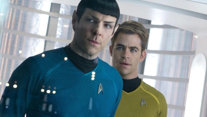 Zachary Pinto (as Spock) and Chris Pine (as Capt. Kirk) lead the cast of ‘Star Trek Into Darkness.’