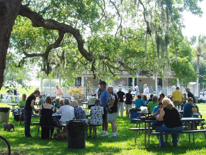Supporters of the New Smyrna Museum of History enjoy a pancake breakfast under the trees at Old Fort Park in New Smyrna Beach.