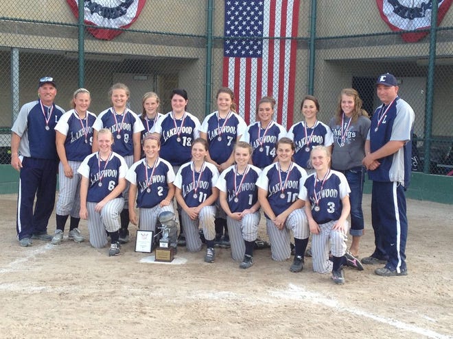 The Lakewood JV softball team poses with the Lansing Softball Classic JV Flight trophy Tuesday at Ranney Park in East Lansing. The Vikings defeated Portland in the championship game to win the title