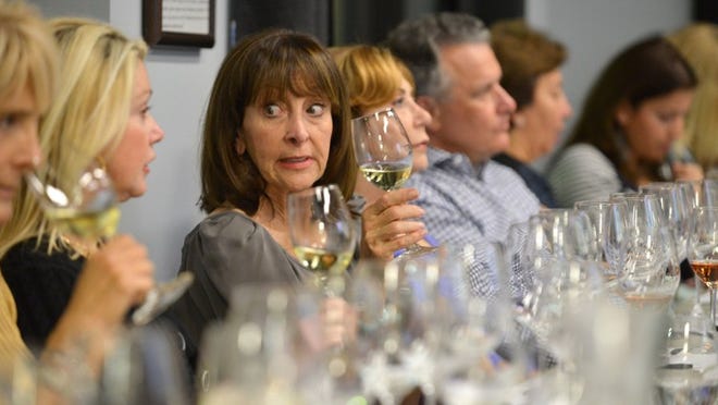 Marilyn Lazarus discusses the L'Anima from Livernano Thursday evening during a wine class at the Virginia Philip Wine Shop and Academy.