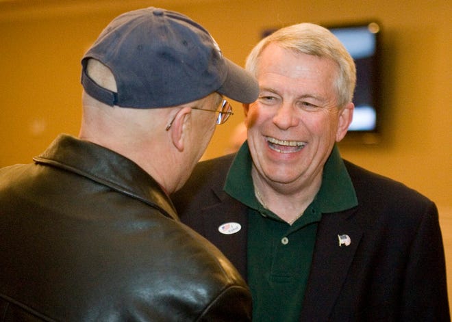 Belvidere Mayor Fred Brereton (left) congratulates Mike Chamberlain after he won the Belvidere mayoral race Tuesday, April 9, 2013, at Bel-Mar Country Club in Belvidere. Chamberlain is scheduled to be sworn into office on May 1.