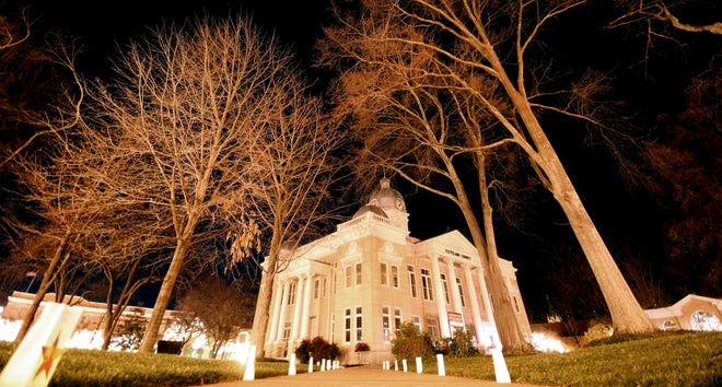 Luminaries light the Uptown Shelby court square in 2011. (Star file photo)