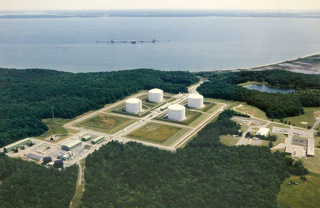 FILE - This undated aerial file photo provided by Dominion shows the Dominion Liquefied Natural Gas (LGN) facility in Cove Point, Md. A domestic natural gas boom already has lowered U.S. energy prices while stoking fears of environmental disaster. Now U.S. producers are poised to ship vast quantities of gas overseas as energy companies seek permits for proposed export projects that could set off a renewed frenzy of fracking. Expanded More than 20 projects to export LNG are under review by the Energy Department. (AP Photo/Dominion)