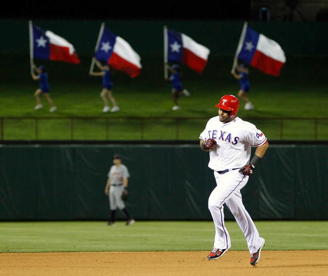 Texas Rangers' Nelson Cruz (17) rounds the bases after hitting a home run against the Detroit Tigers on Thursday. The Rangers won, 10-4.