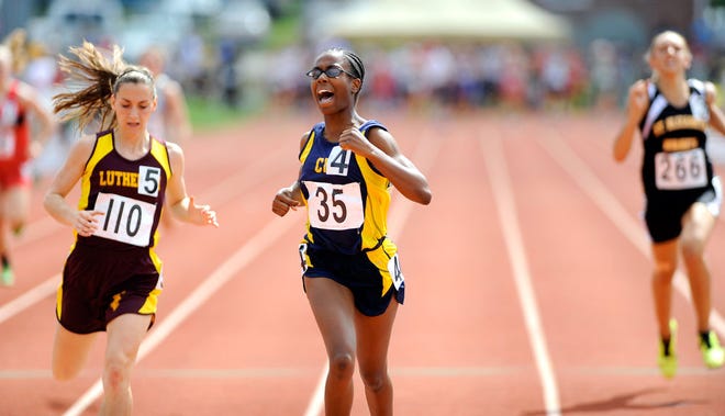 CIS’s Nicole Neville (35) wins her preliminary heat in the 400 meters yesterday in the MSHSAA Class 1 Track and Field Championships. She also qualified for the finals in the 100 and 200.