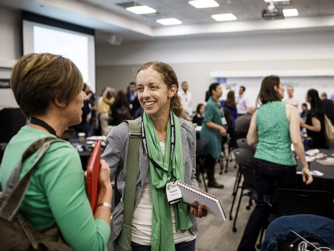 Rachelle Doorley, center, arts educator and writer at TinkerLab, and Samantha Barnes, founder and culinary coach at Kitchen Kid, talk during the MamaBear family tech conference at the Microsoft campus in Mountain View, Calif., recently.
DAI SUGANO | SANJOSE MERCURY NEW