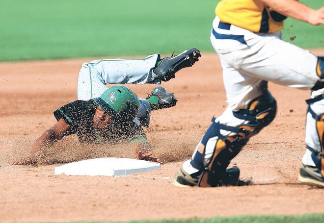 Haines City's Jadis Ortega slides safely into third base during the Class 7A state semifinal against St Thomas Aquinas.