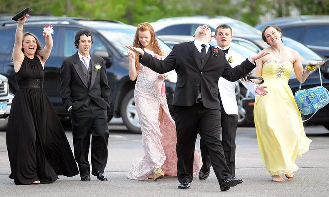 Students arrive for the Medway High School Junior/Senior prom at the Double Tree Hotel in Milford on Friday.