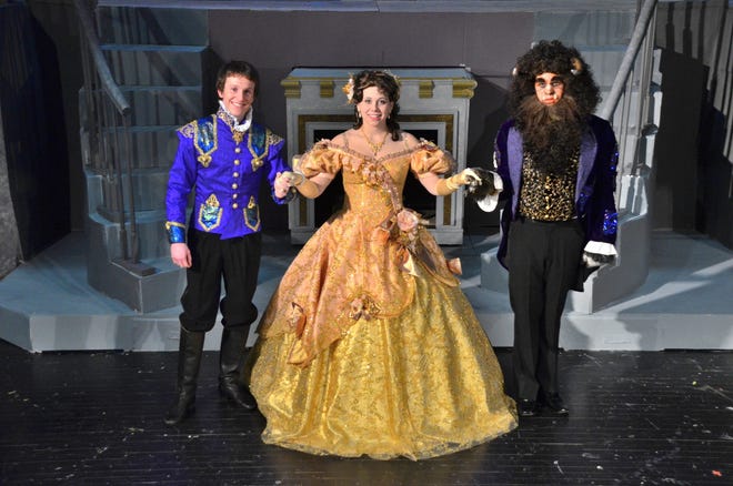 Megan Bartimoccia plays Belle in the April production of “Beauty and the Beast” at Boylan Catholic High School in Rockford. Drew Hazen (left) plays the prince in non-beast form, and Raymond Fanara plays the Beast.