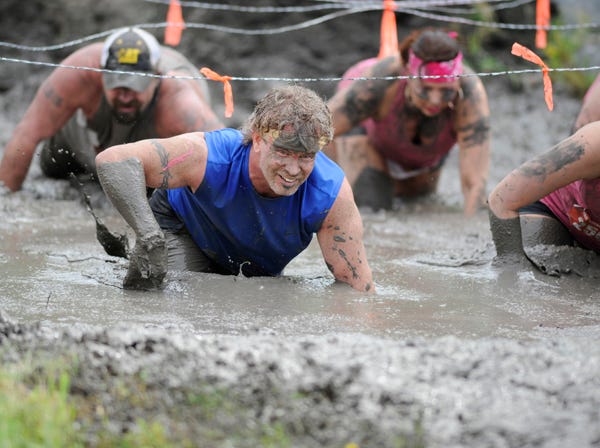 J. Dennis Thomas | Nuvision Action Image LLC | Associated Press

A contestant is shown competing in The Mud Monster on April 27 during The Survival Race in Dallas. The current trend in obstacle racing started a few years ago, when elite athletes started looking for new challenges, ones without the joint-jarring pain of long-distance running or the cost of triathlons.