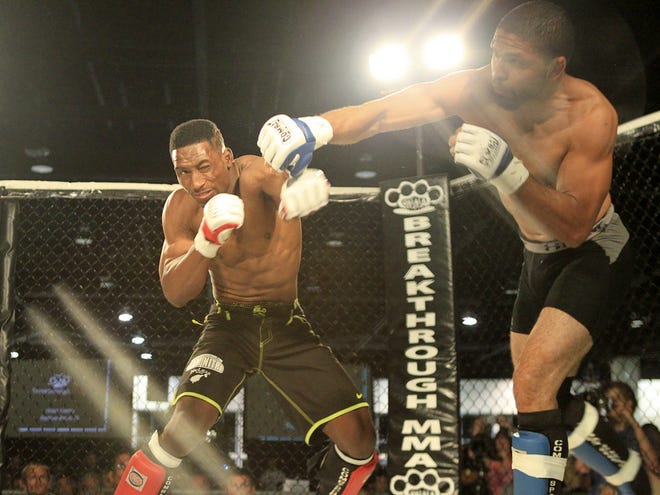 Fight Sports Daytona's Anderson Hutchinson fights with Legendz MMA's Nehshon Nicks of in Breakthrough MMA's Proving Ground 8 at the Ocean Center in Daytona Beach on Saturday.