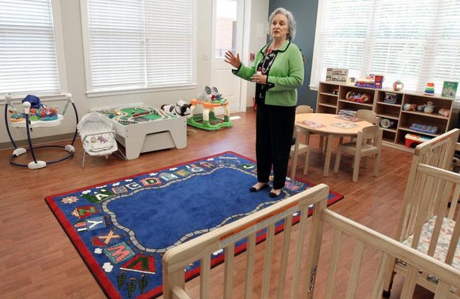 Jeannie Wray, executive director of the Room at the Inn facility, talks about the children’s play room inside their location at Belmont Abbey College.