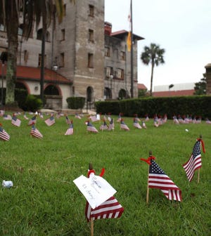 American flag with names of veterans decorate the lawn of the Lightner Building in St. Augustine as part of the Pilot Club of St. AugustineÕs annual Memorial Day tribute to veterans on Memorial Day, Monday, May 28, 2012. By Renee Unsworth, renee.unsworth@staugustine.com