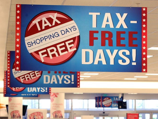 Signs advertising Tax-Free Days hang in Belk's at The Pavilion in Port Orange in 2012 during last year's tax-free holiday.