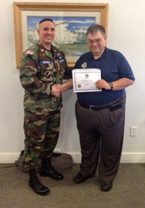 Second Lt. Mike Seiloff of Ionia County's Civil Air Patrol the 222nd (right) was honored by 703rd's Group Commander Major Gutierrez for his fundraising efforts.