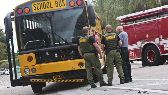 On March 6, a school bus collided with another car at 6th Avenue North and D Street in Lake Worth. According to the sheriff’s report, several witnesses told investigators they saw the woman texting on her phone as she approached the intersection in her car and saw her run the stop sign. Three children on the bus were taken to St. Mary’s Medical Center with minor injuries. (Bruce Bennett/The Palm Beach Post)