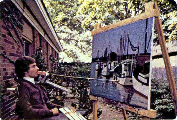 In 1976, Robert Spencer uses a telescopic mouth stick to paint          Boats at Harbor on his patio at Creative Living.