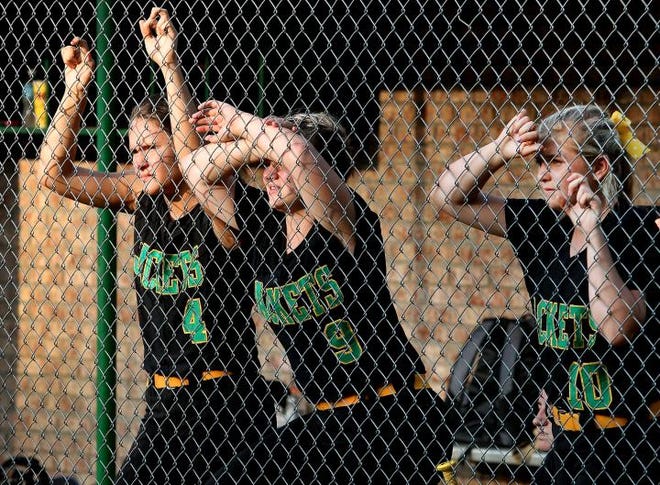 Bessemer City players, from left, Macey Wise, Michelle Miller and Kirsten McConnell watch from the dugout during the Yellow Jackets' 8-0 loss to Chatham Central on Tuesday.